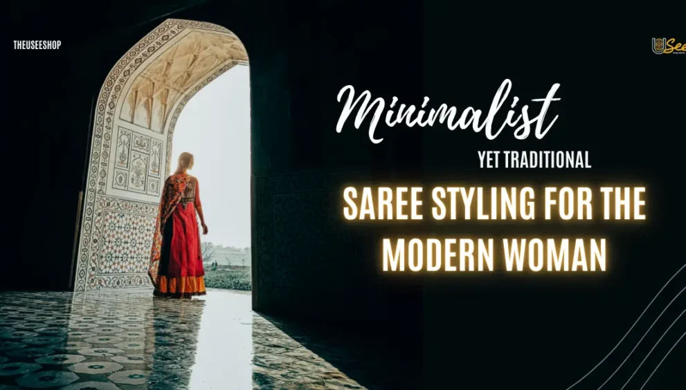 A woman in a red Banarasi saree stands by an ornate archway, reflecting a blend of tradition and modern minimalism in saree styling.