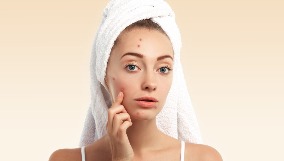 Brightening face scrub on bathroom counter with towel and natural ingredients