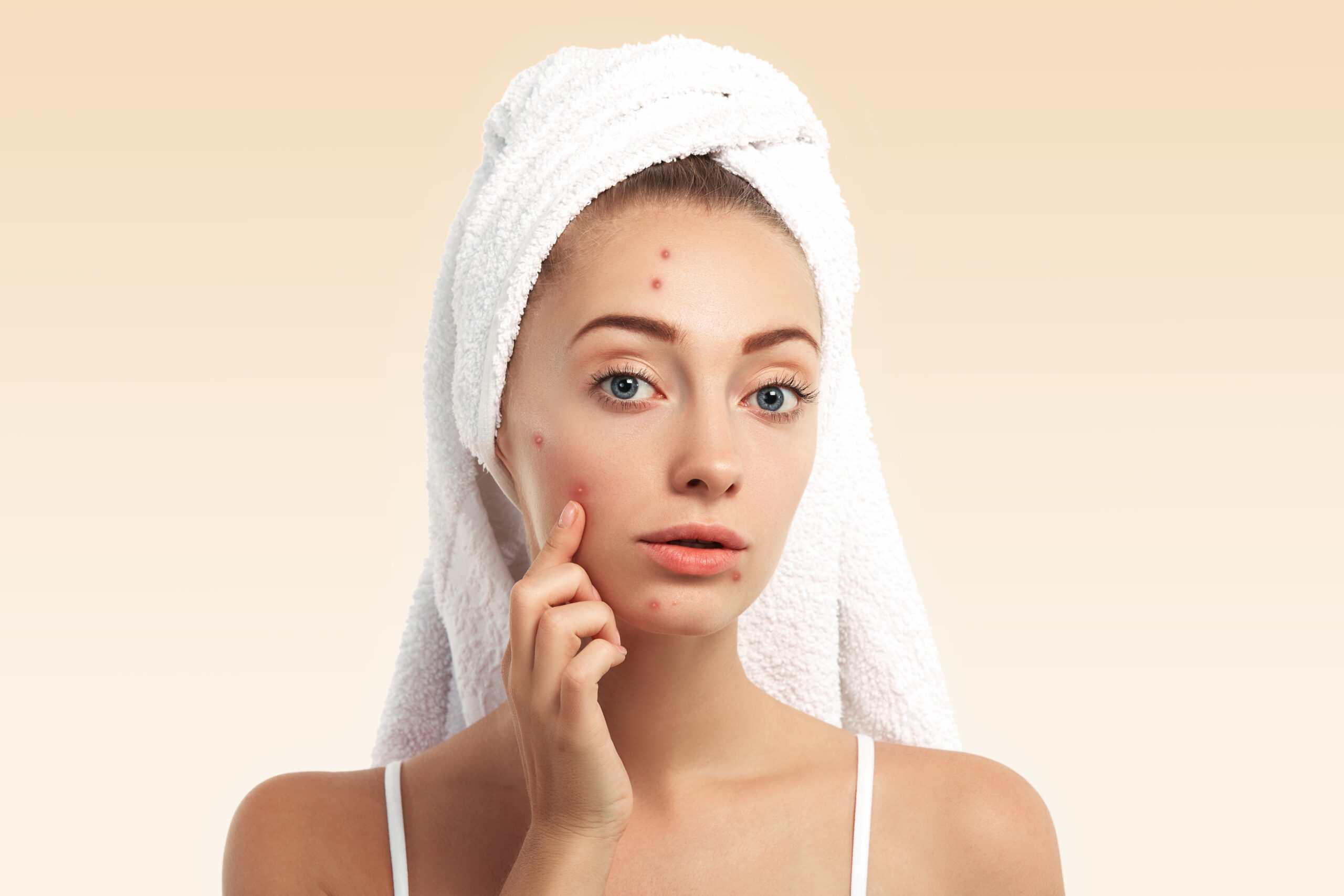 Brightening face scrub on bathroom counter with towel and natural ingredients