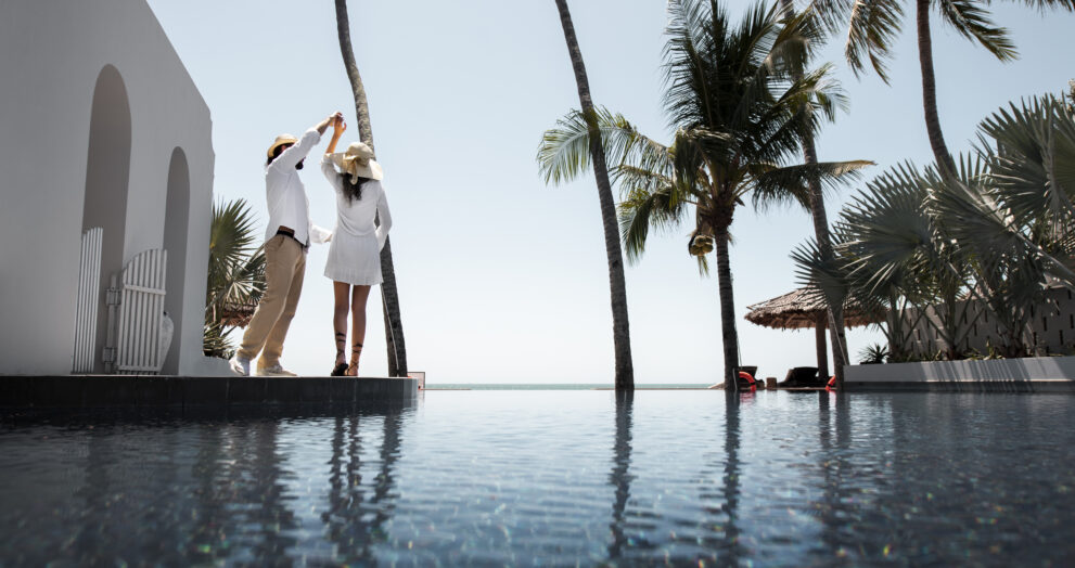 Professional hotel staff offering warm and personalized service at a Cochin 4-star hotel.